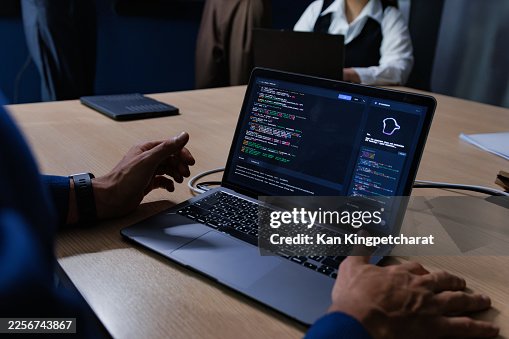 Close-up of Software engineer using AI assistant for coding during team brainstorming session. Close-up of Software engineer using AI assistant for coding during team brainstorming session.