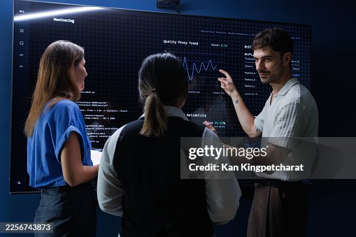 Group of Professional DevOps engineers analyzing network server performance and system agility. Group of Professional DevOps engineers analyzing network server performance and system agility.