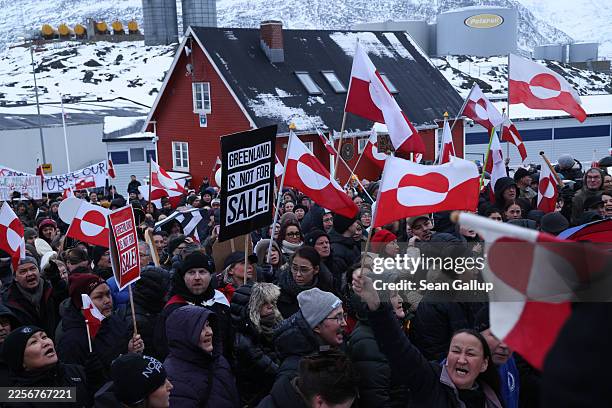 People bear Greenlandic flags as they gather in front of the U.S. Consulate protest against U.S. President Donald Trump and his announced intent to...
