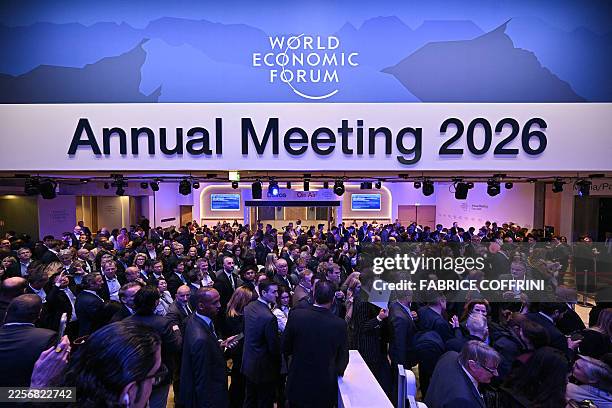 Visitors queue to enter the Congress hall to attend US President's special address during the World Economic Forum annual meeting in Davos on January...