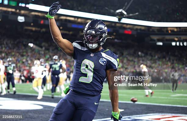 Kenneth Walker III of the Seattle Seahawks celebrates a touchdown during the second quarter against the San Francisco 49ers during the second quarter...