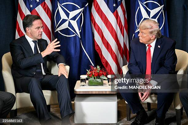 President Donald Trump speaks with NATO's Secretary-General Mark Rutte during a bilateral meeting on the sidelines of the World Economic Forum annual...