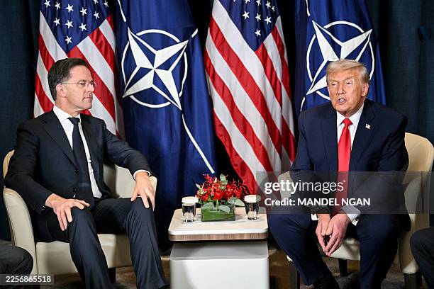 President Donald Trump speaks with NATO's Secretary-General Mark Rutte during a bilateral meeting on the sidelines of the World Economic Forum annual...