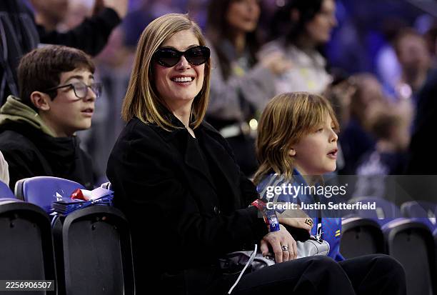 Actress Rosamund Pike smiles in the stands prior to the NBA Match between Orlando Magic and Memphis Grizzlies at The O2 Arena on January 18, 2026 in...