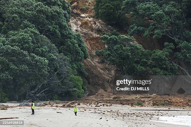 General view shows a landslide while a search is underway by local emergency services for missing people at Mount Maunganui in Tauranga on January...