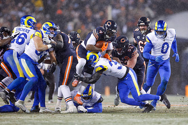 Andre Swift of the Chicago Bears runs the ball during the second quarter of the NFC Divisional playoff game against the Los Angeles Rams at Soldier...