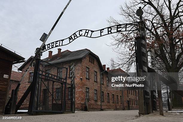 View of the 'Arbeit Macht Frei' sign at the former Nazi German concentration camp Auschwitz-Brikenau in Oswiecim, Poland on January 22, 2026.