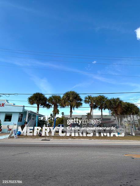 merry christmas sign on matlacha park road in florida - matlacha stock pictures, royalty-free photos & images