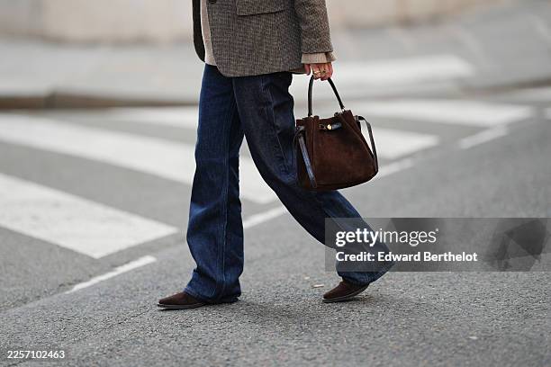 Diane Batoukina wears a grey textured tailored blazer by Gerard Darel with notched lapels and front button fastening, dark blue straight-leg denim...