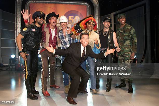 Host Dick Clark with a non-original line-up of disco group Village People, at the taping of "American Bandstands 50th...A Celebration" television...