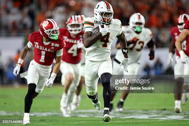 Mark Fletcher Jr. #4 of the Miami Hurricanes runs for a third quarter touchdown against the Indiana Hoosiers in the 2026 College Football Playoff...