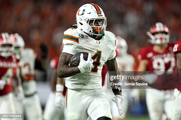 Mark Fletcher Jr. #4 of the Miami Hurricanes runs for a third quarter touchdown against the Indiana Hoosiers in the 2026 College Football Playoff...