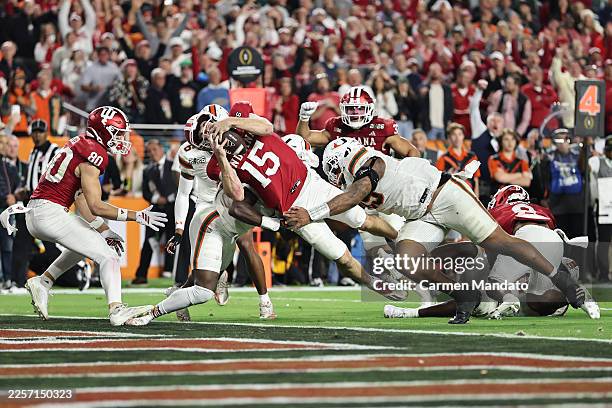 Fernando Mendoza of the Indiana Hoosiers dives for a fourth quarter touchdown against the Miami Hurricanes in the 2026 College Football Playoff...