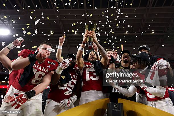 The Indiana Hoosiers celebrate with the College Football Playoff National Championship Trophy after defeating Miami Hurricanes 27-21 in the 2026...