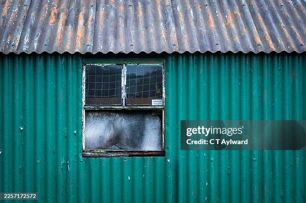 bright green corrugated shed garage building - steel shed stock pictures, royalty-free photos & images