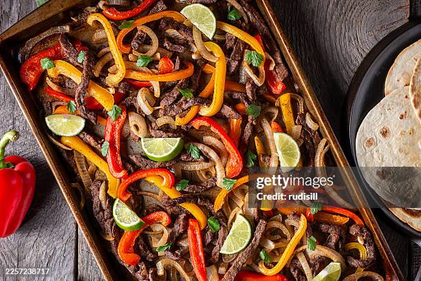 sheet pan steak fajitas - fajita stock pictures, royalty-free photos & images