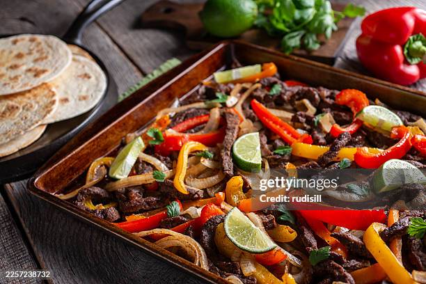 sheet pan steak fajitas - baking sheet stock pictures, royalty-free photos & images