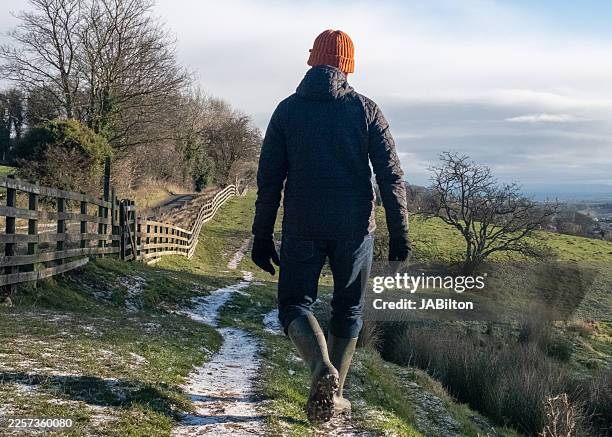 solo traveller enjoys a country walk in winter - richmond yorkshire stock pictures, royalty-free photos & images