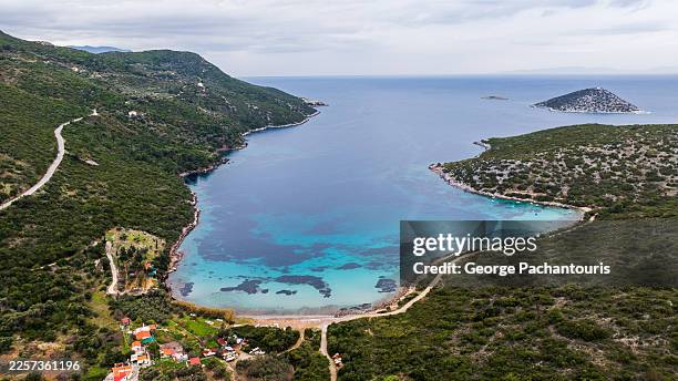 aerial view of coastal bay on samos island, greece - baia foto e immagini stock