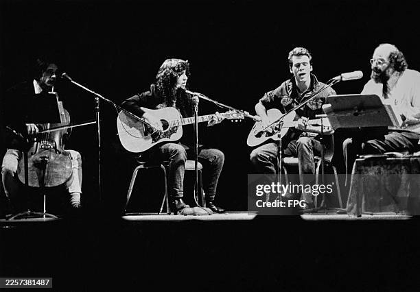 American poet and writer Allen Ginsberg performing on stage with a band, circa 1975.