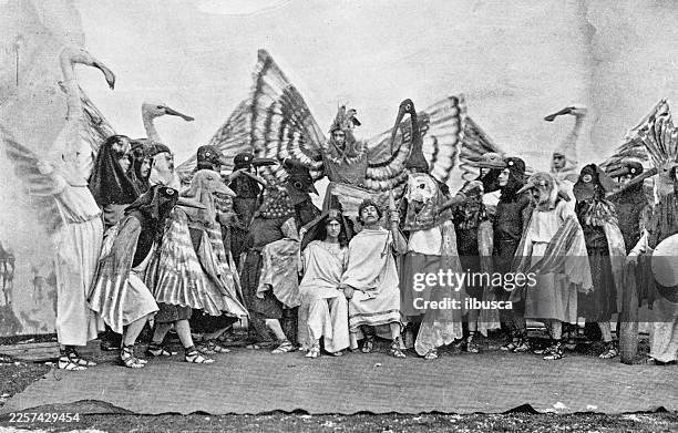 the birds (play by aristophanes) at cambridge university - stage set stock illustrations