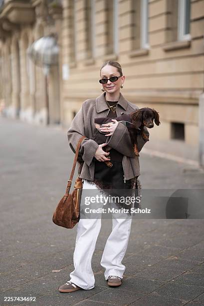 Sonia Sofianidou is seen wearing a brown wool jacket with a clean structured shape, a peak collar and zipper front from Zara; a brown sweater with a...