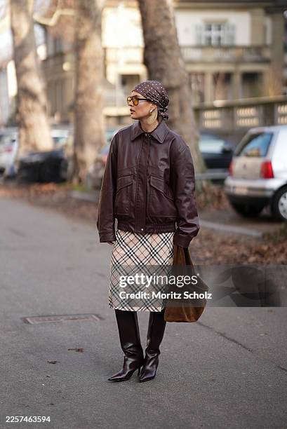 Julia Kammerer is seen wearing a dark brown leather aviator jacket with classic collar, zip front, flap pockets and slightly oversized fit from H&M;...