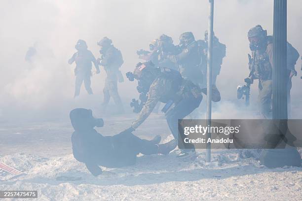 Protesters clash with law enforcement after a federal agent shot and killed a man on Jan. 24 â" the second federal-involved shooting in the city this...