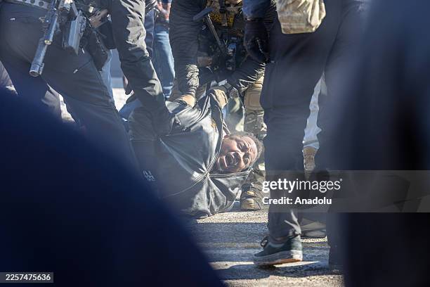 Protesters clash with law enforcement after a federal agent shot and killed a man on Jan. 24 â" the second federal-involved shooting in the city this...