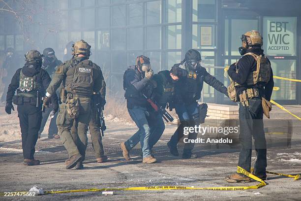 Protesters clash with law enforcement after a federal agent shot and killed a man on Jan. 24 â" the second federal-involved shooting in the city this...