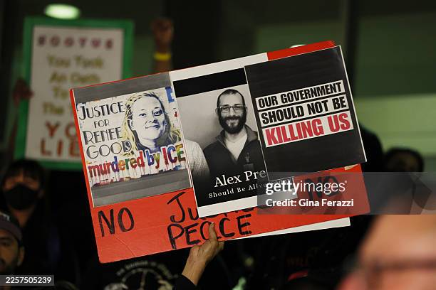 Los Angeles, CA A sign is raised in support of Renee Good and Alex Pretti at a candle light vigil during a peaceful protest in support of a...