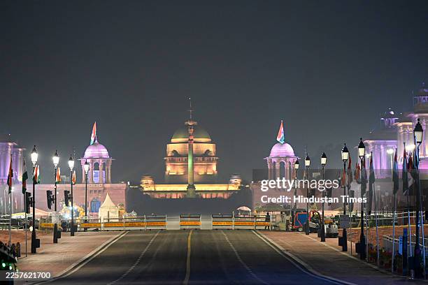 Security remains on high alert in front of the illuminated Rashtrapati Bhavan on the eve of Republic Day celebrations, on January 25, 2026 in New...