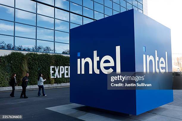 The Intel logo is displayed on a sign in front of Intel headquarters on January 22, 2026 in Santa Clara, California. Intel will report fourth-quarter...