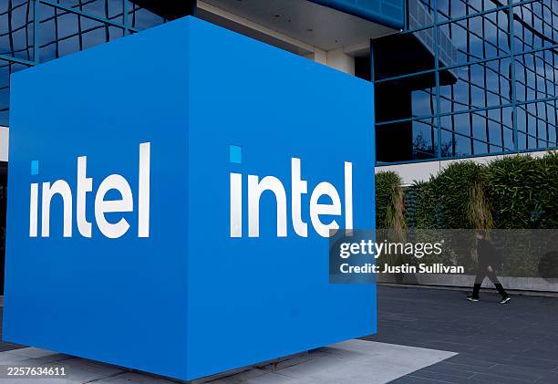 The Intel logo is displayed on a sign in front of Intel headquarters on January 22, 2026 in Santa Clara, California. Intel will report fourth-quarter...
