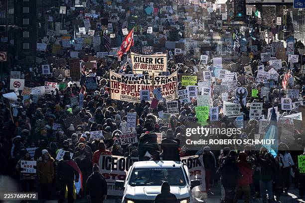 Protesters against Immigration and Customs Enforcement march through the streets of downtown Minneapolis, Minnesota, on January 25, 2026. On January...