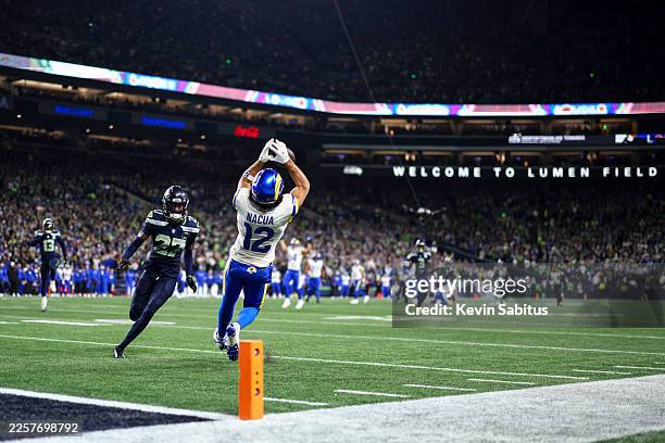 Puka Nacua of the Los Angeles Rams makes the catch for a touchdown during the third quarter of the NFC Championship NFL football game against the...