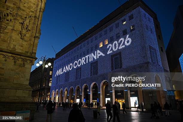 Milano Cortina 2026 illuminations are seen on the Rinascente department store at night in Piazza Duomo ahead of the Milano Cortina 2026 Olympic...