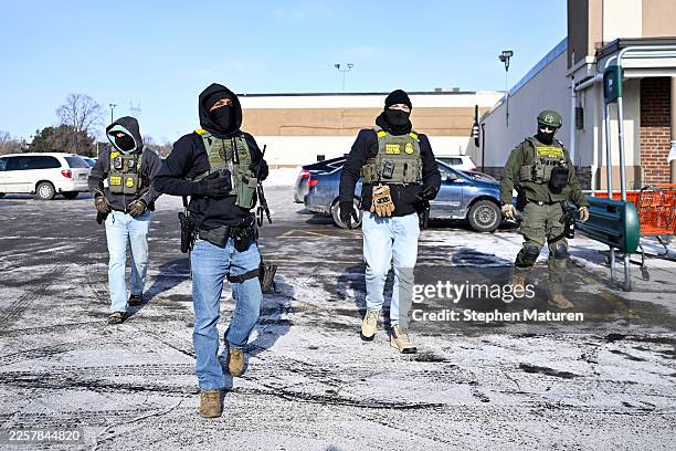 Border Patrol agents are confronted by observers in the parking lot of the Asian grocery store Dragon Star Oriental Foods on January 23, 2026 in St....
