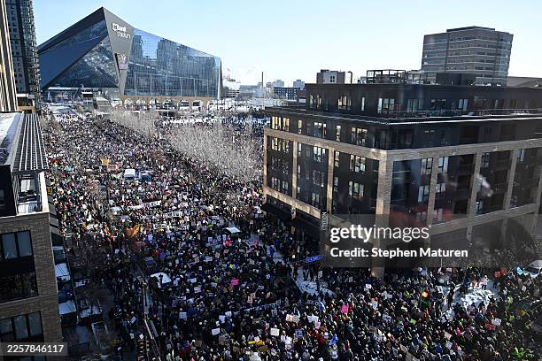 Demonstrators participate in a rally and march during an "ICE Out” day of protest on January 23, 2026 in Minneapolis, Minnesota. Community leaders,...