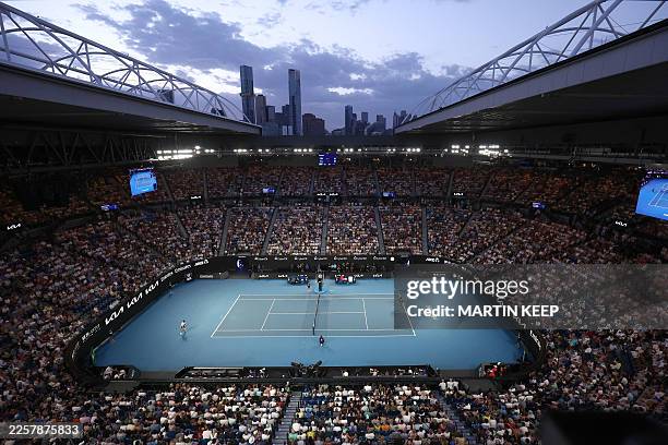 General view of the Rod Laver Arena at the sunset during the men's singles quarter-final match between Spain's Carlos Alcaraz and Australia's Alex De...
