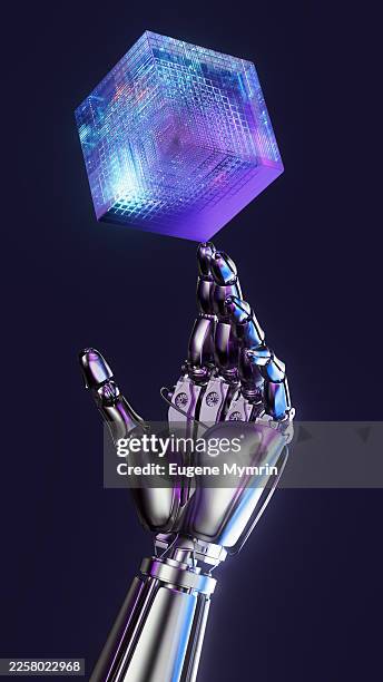 robotic hand balancing glowing data cube representing artificial intelligence - digital cube stock pictures, royalty-free photos & images