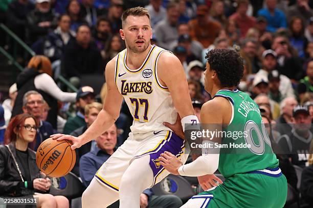 Luka Doncic of the Los Angeles Lakers drives against Max Christie of the Dallas Mavericks during the first quarter at American Airlines Center on...