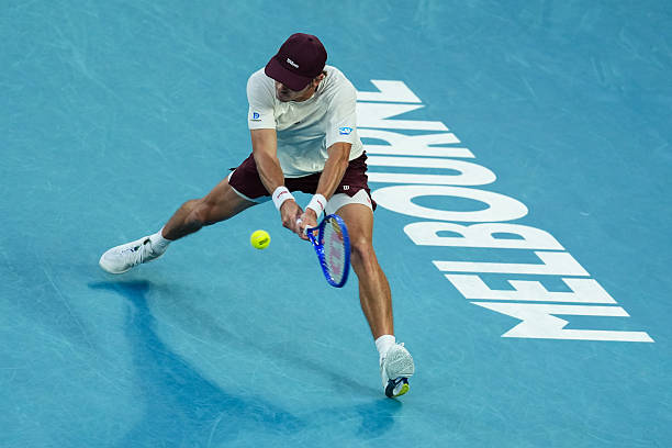 Alex de Minaur of Australia plays a backhand in the Men's Singles Fourth Round match against Alexander Bublik during day eight of the 2026 Australian...