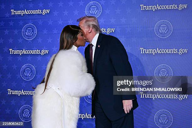 President Donald Trump greets Trinidadian rapper and singer-songwriter Nicki Minaj during an event on 'Trump Accounts' at the Andrew W. Mellon...