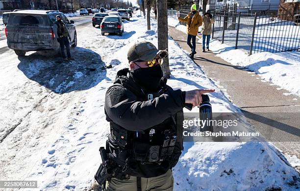 An ICE agent points a can of pepper spray at an observer on January 28, 2026 in Minneapolis, Minnesota. The U.S. Department of Homeland Security...
