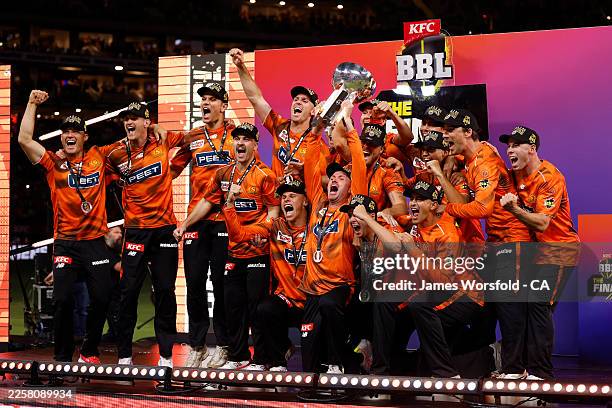 Perth Scorchers celebrate winning the the KFC BBL Championship Trophy during the BBL Final match between Perth Scorchers and Sydney Sixers at the...