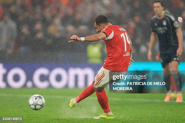 Benfica's Greek forward Vangelis Pavlidis takes a penalty kick and scores his team's second goal during the UEFA Champions League league phase day 8...