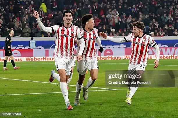 Igor Matanovic of Sport-Club Freiburg celebrates scoring his team's second goal with teammates Derry Scherhant and Philipp Treu during the Bundesliga...