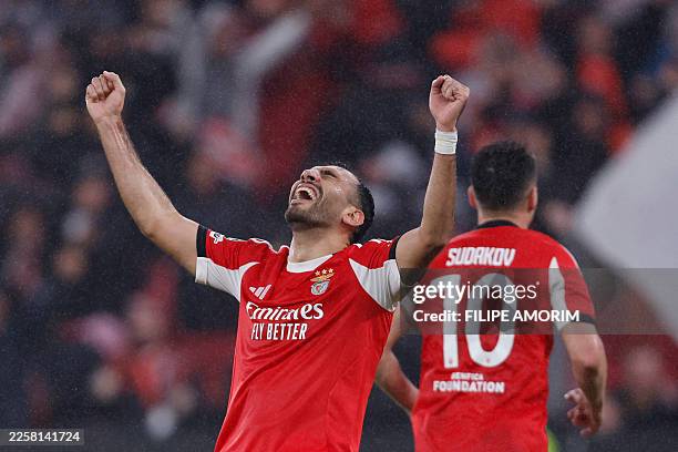Benfica's Greek forward Vangelis Pavlidis celebrates his team's third goal scored by Norwegian forward Andreas Schjelderup during the UEFA Champions...