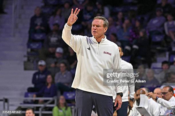 Head coach Bill Self of the Kansas Jayhawks sends in instructions in the second half of a game against the Kansas State Wildcats at Bramlage Coliseum...